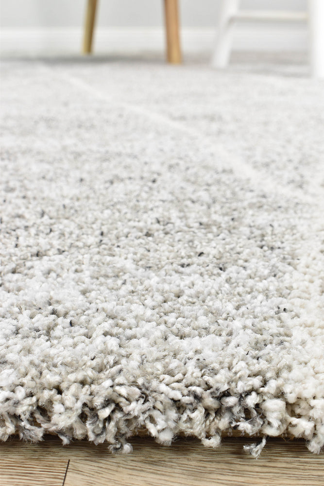 Close-up of Alpha Shaggy Grey rug's soft texture.