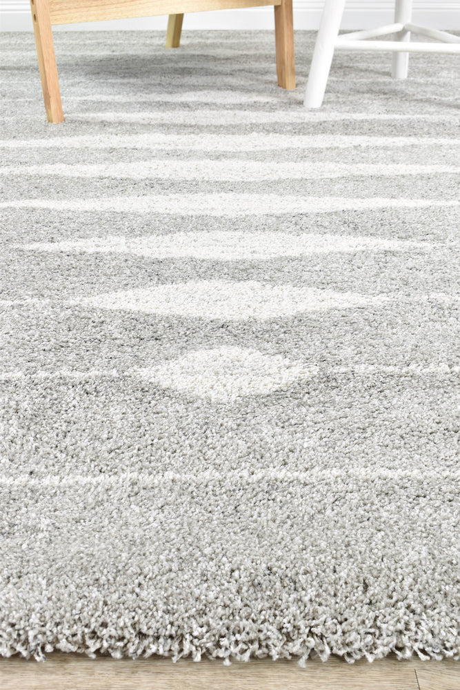 White and silver shaggy rug with thick pile for modern interiors