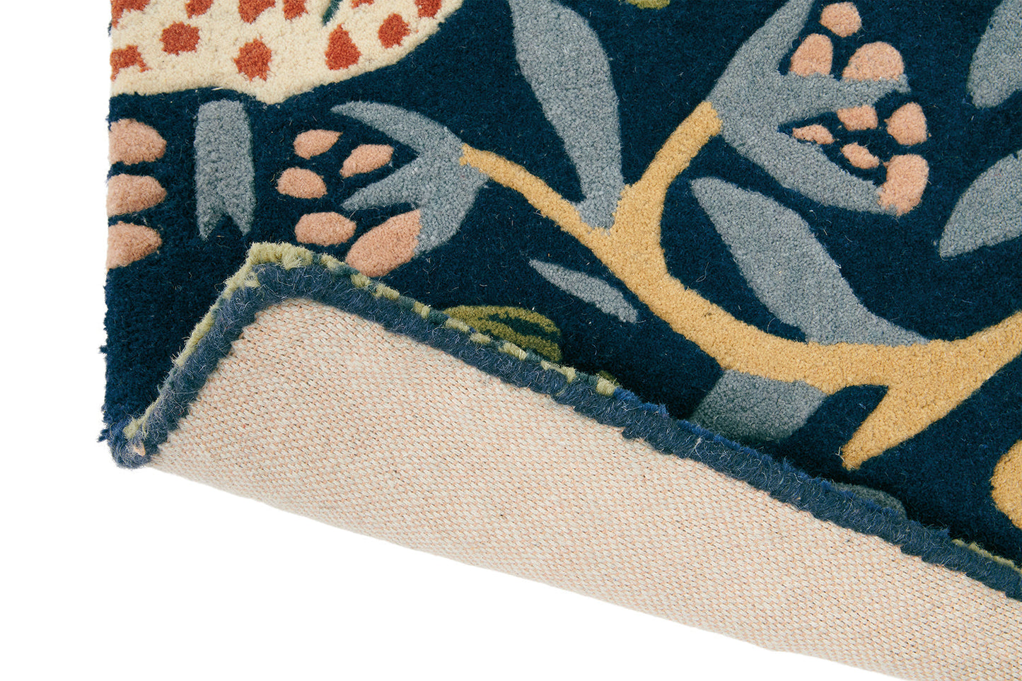 Detailed shot of the Strawberry Thief Indigo rug showing vibrant colors.