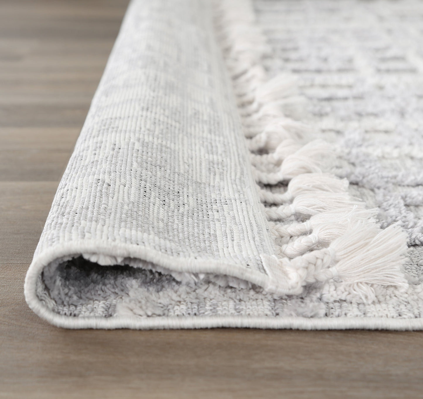 Close-up of textured Bilbao rug in grey tones