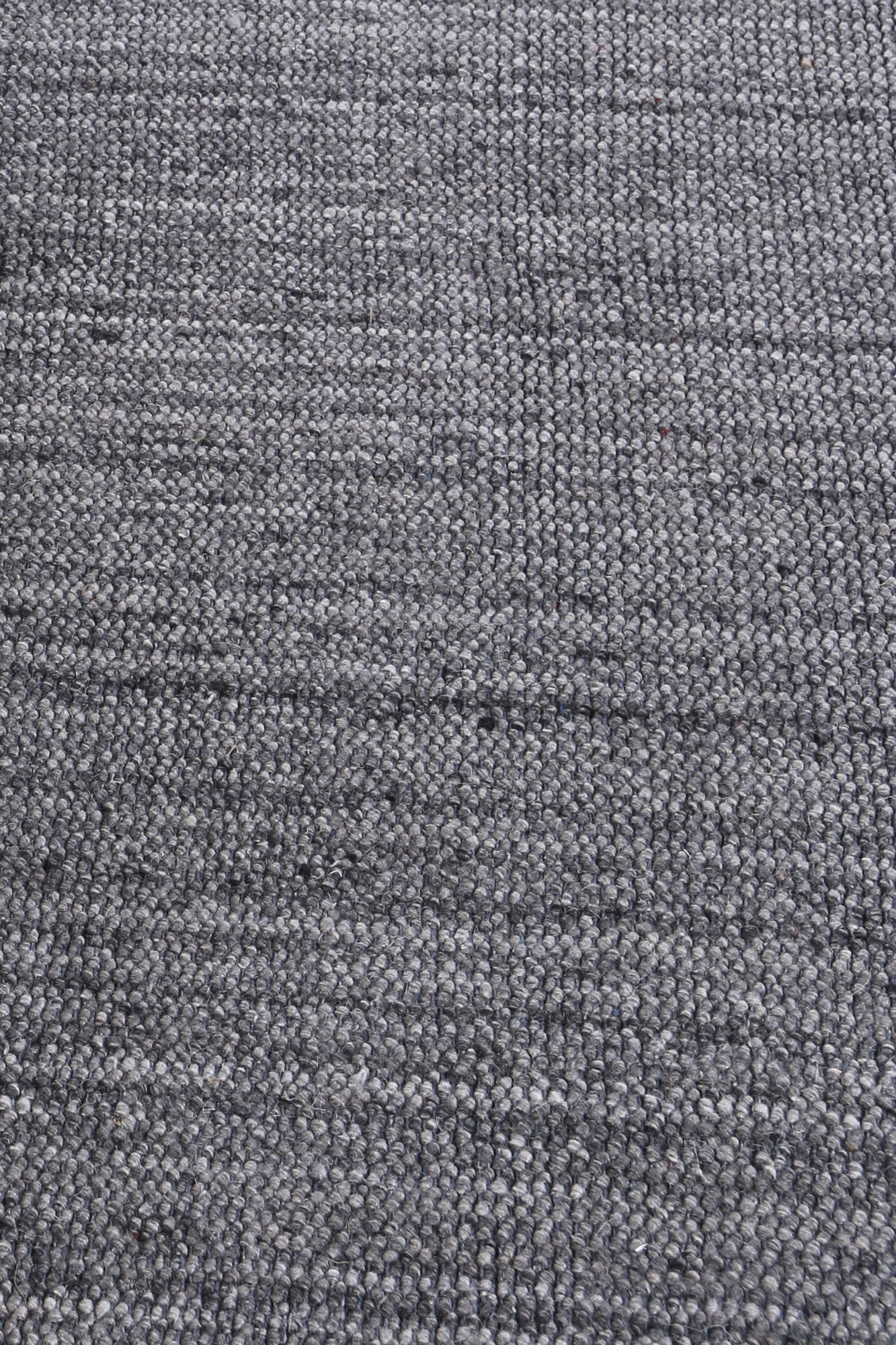 Pebble Storm rug in grey tones with organic pebble-like pattern
